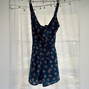 Floral Romper With adjustable bow in the front